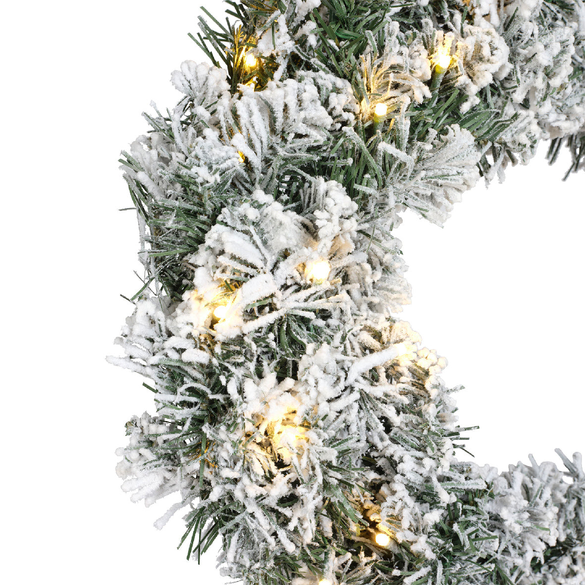 Detail kerstkrans: zilveren besneeuwde takken met warmwitte lichtjes