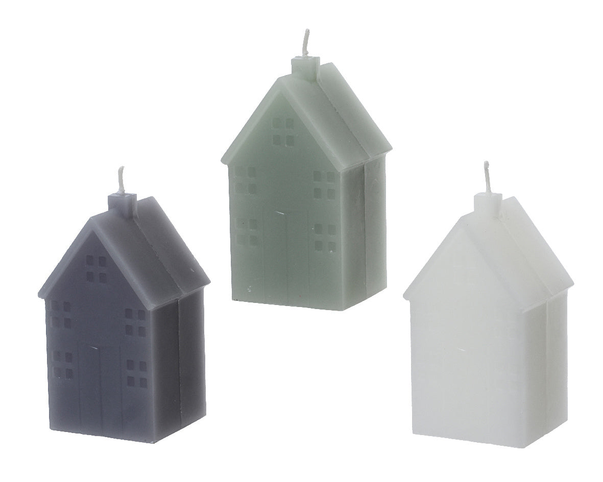 Huisvormige kaarsenset van paraffine: drie kleurige huisjes, met lonten
