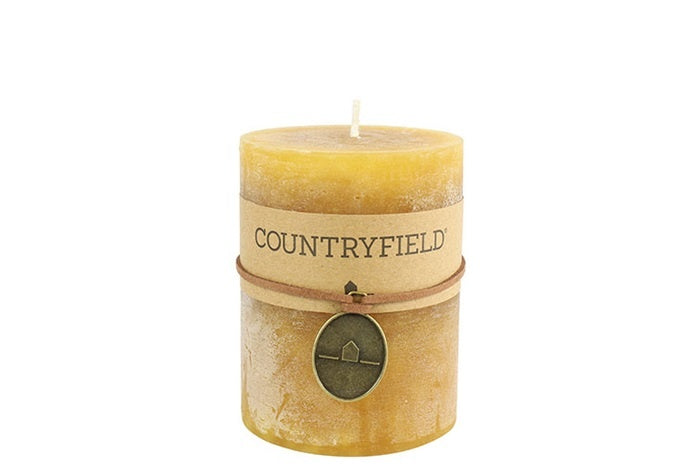 Amberkleurige cilindrische kaars met lont en Countryfield-label
