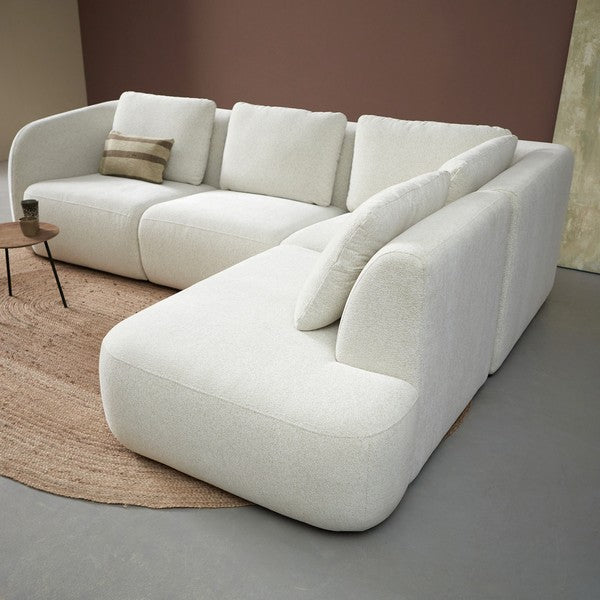 Witte bank met chaise/ottoman rechts en decoratieve kussens, massieve vorm