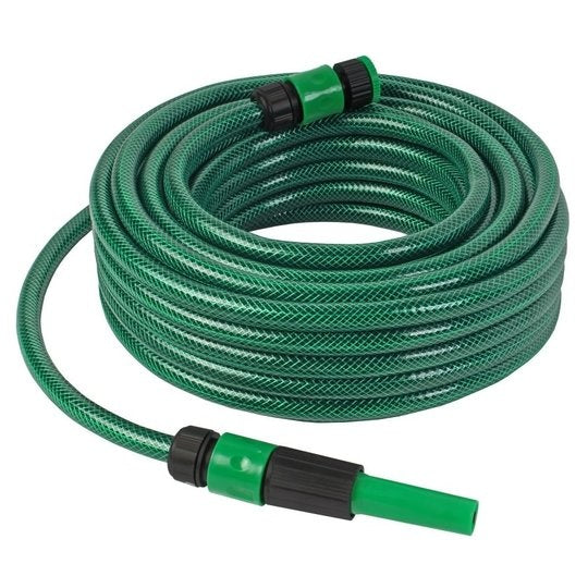 Groene tuinslangset met haspel, koppelingen en spuitmond