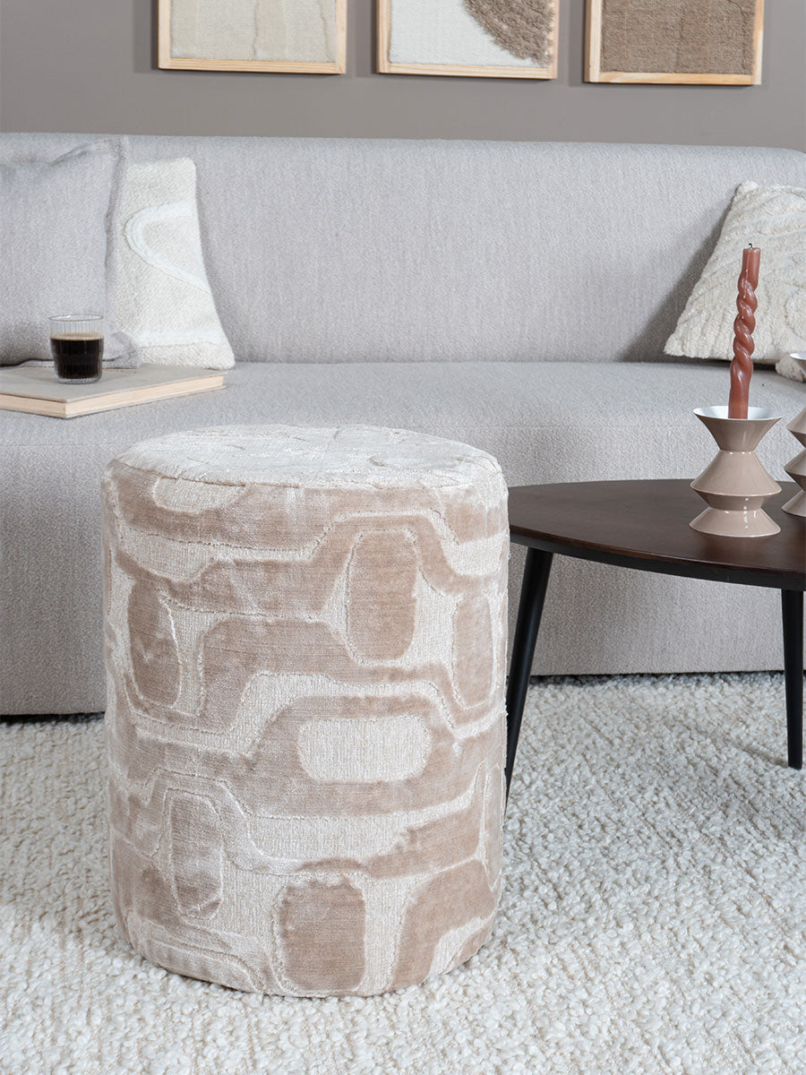Cilindrische poef in beige structuurstof met abstract geometrisch patroon