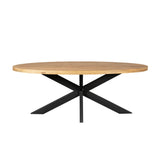 Ovale eettafel met houten blad en zwarte kruisvormige metalen poten