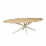 Ovale eettafel met licht eiken nerfblad en kruisende poten in wit-beige