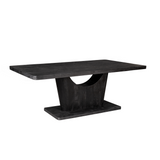 Zwarte eettafel met rechthoekig blad en stevige centrale poot, houtnerfafwerking.