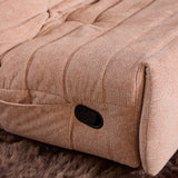 Roze relaxfauteuil met zwarte bedieningsknop op de armleuning